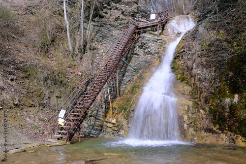 View of Lace (Shnurok) waterfall in Teshebs river gorge on sunny winter day. Gebiusskie waterfalls, Krasnodar Krai, Caucasus, Russia. photo