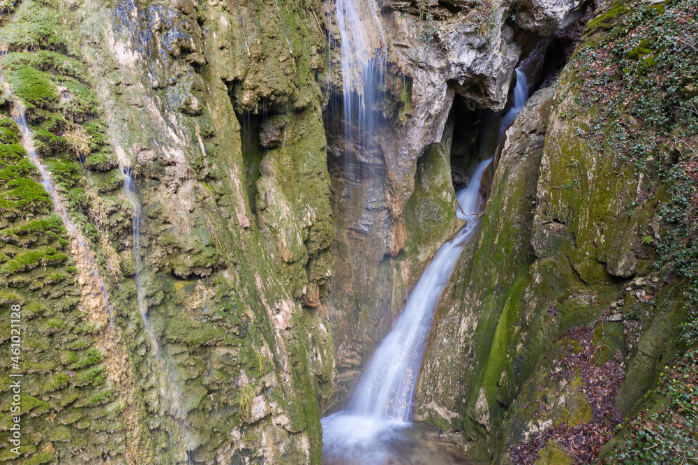 View of Grotto waterfall in Teshebs river gorge on winter day. Gebiusskie waterfalls, Krasnodar Krai, Caucasus, Russia.