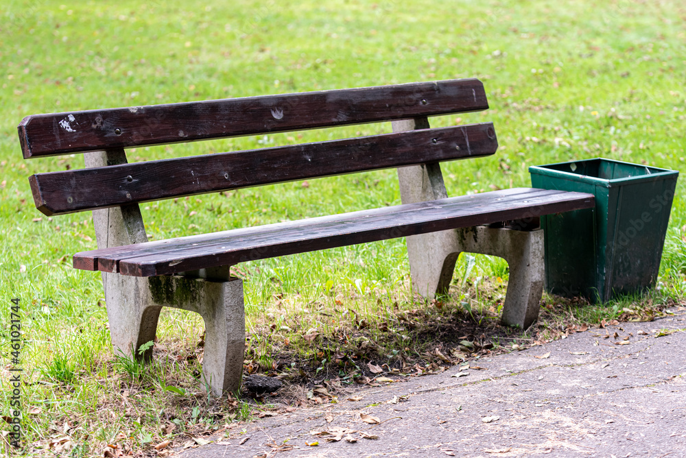 bench with trash can in the city park bench with trash can in the city park