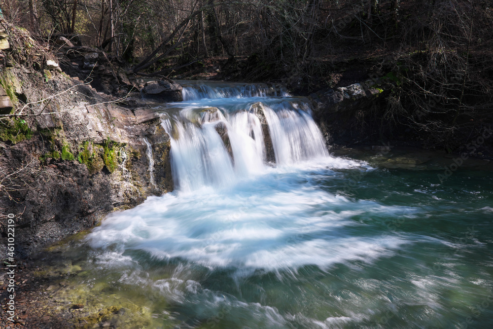 View of waterfall on Zhane river on sunny winter day. Krasnodar Krai, Caucasus, Russia.