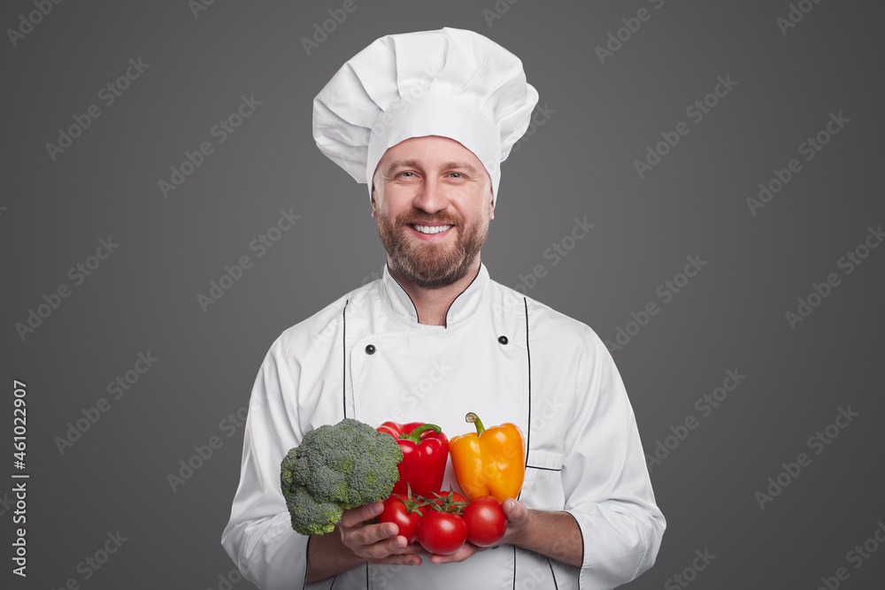 Happy chef with fresh vegetables Happy chef with fresh vegetables