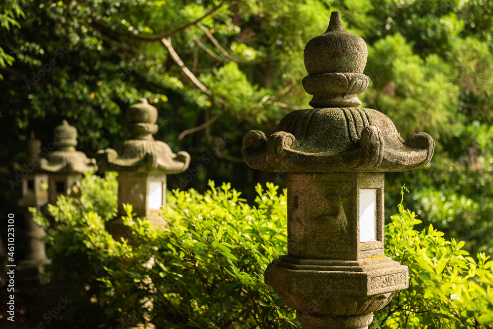Traditional stone lantern in Japanese temple garden. Traditional stone lantern in Japanese temple garden.