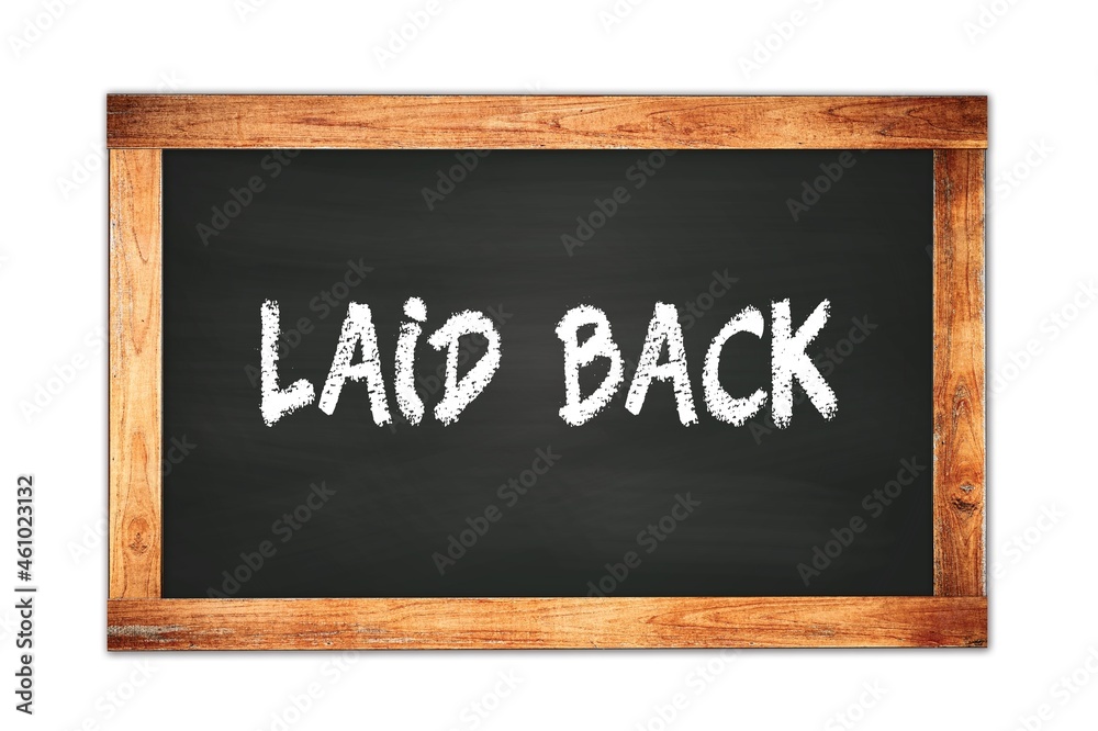LAID BACK text written on wooden frame school blackboard. LAID BACK text written on wooden frame school blackboard.