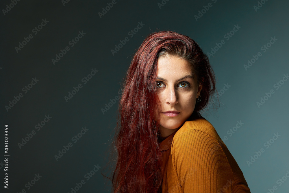 portrait of a Caucasian woman with a beautiful red hairstyle surrounding her head. portrait of a Caucasian woman with a beautiful red hairstyle surrounding her head.