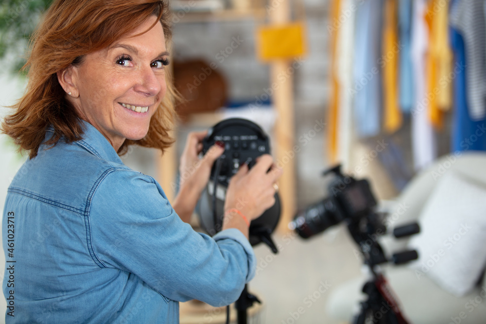 photographer woman adjusts equipment flash photographer woman adjusts equipment flash
