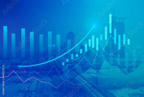 Stock market digital graph chart on LED display concept. A large display of daily stock market price and quotation. Indicator financial with buildings background