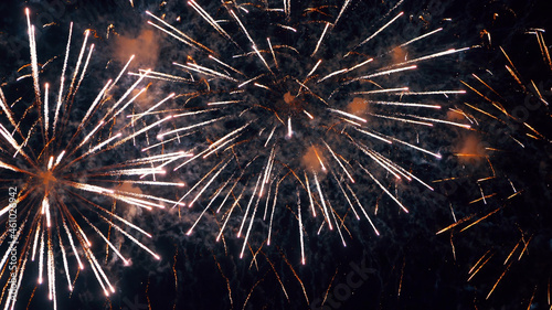 Fireworks Festival Background. Shining Real Fireworks With Bokeh Lights In The Night Sky. Glowing Fireworks Show. New Year's Eve Fireworks Celebration Holiday. Colorful Firework Flashes At Night