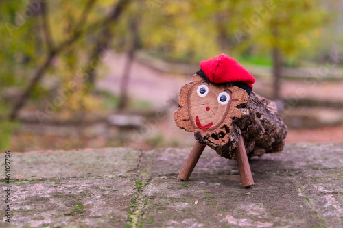 Tió de Nadal. A hollow log with a barretina, called Tió, is a Catalan Christmas tradition. The children feed him and on Christmas Day he shits them presents. photo