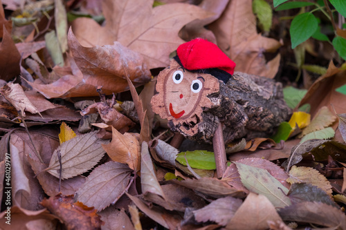 Tió de Nadal. A hollow log with a barretina, called Tió, is a Catalan Christmas tradition. The children feed him and on Christmas Day he shits them presents. photo