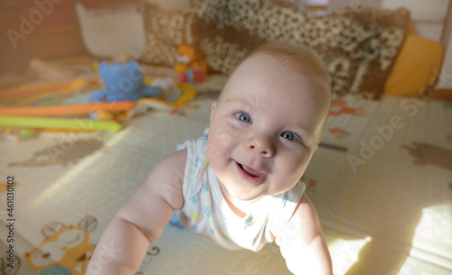 Baby portrait. Closeup face with bright blue eyes