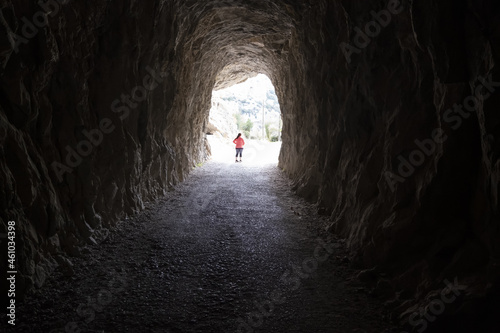 Woman in dark tunnel