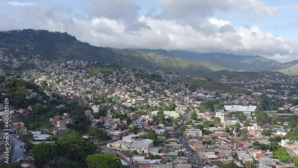 Aerial view Tegucigalpa Honduras. Favelas in a dangerous area standing at the foot of the mountains, a poor area with huts. Aerial view Tegucigalpa Honduras. Favelas in a dangerous area standing at the foot of the mountains, a poor area with huts.