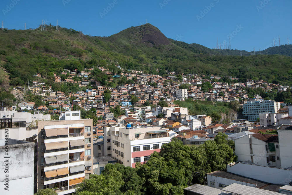 urban area with slums, simple buildings usually built on the hillsides of the city