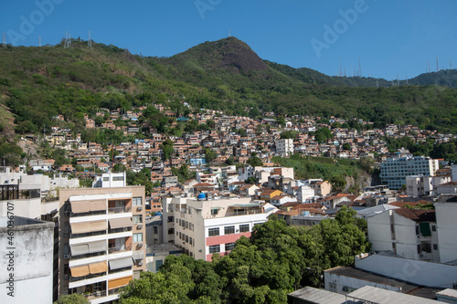 urban area with slums, simple buildings usually built on the hillsides of the city