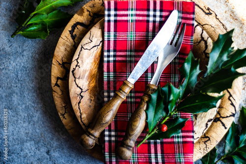 Festive place setting with holly decorations for Christmas photo