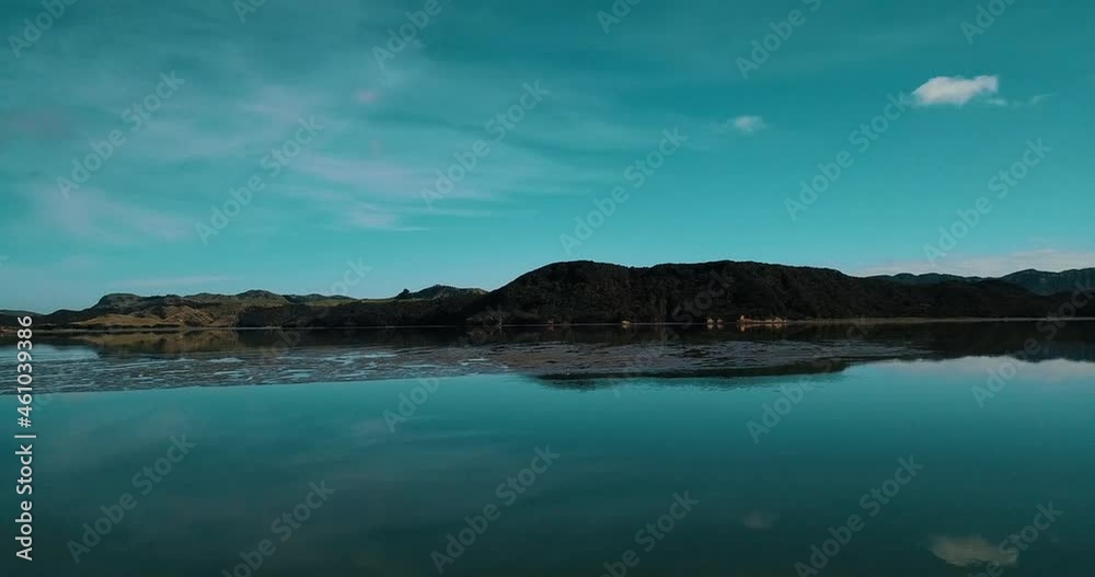 Flight over the surface of Whanganui Inlet's serene summer waters - New Zealand Flight over the surface of Whanganui Inlet's serene summer waters - New Zealand
