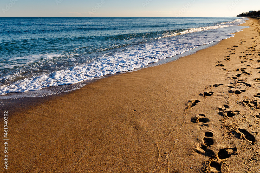 Footprints on the beach. A footprint of human feet on the sand near the sea. Footprints on the beach. A footprint of human feet on the sand near the sea.