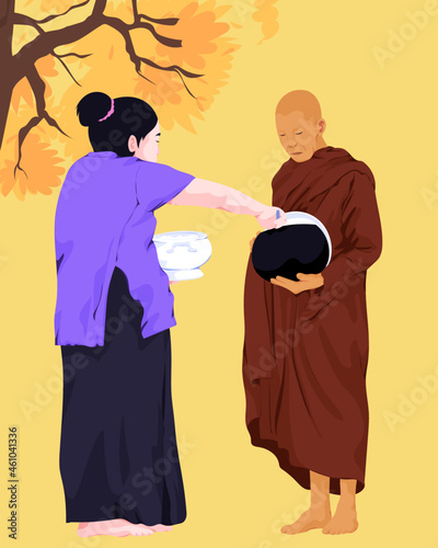 Woman making merit with Buddhist monk