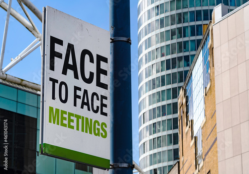 Face to Face meetings sign in Downtown city setting