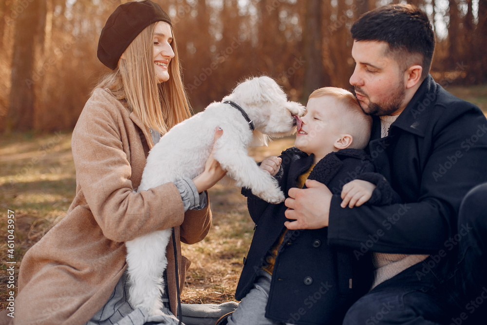 Cute family playing in a spring park Cute family playing in a spring park