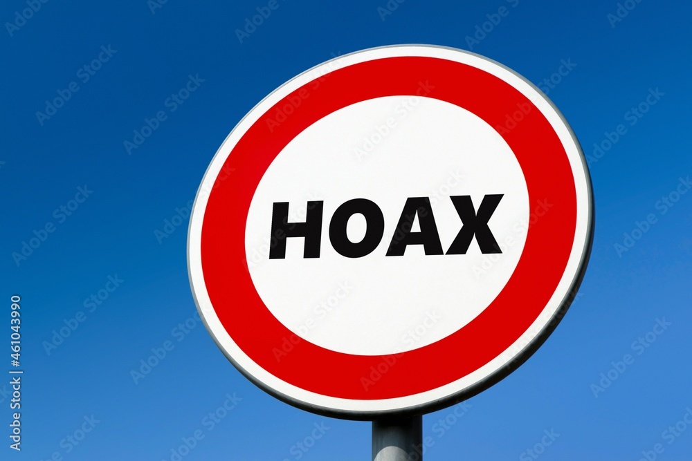 Traffic sign with HOAX text as a protest against false information Traffic sign with HOAX text as a protest against false information