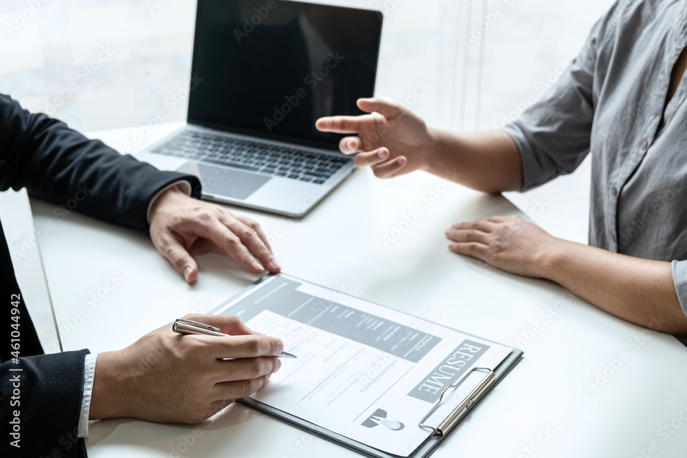 Businessman interview consider a resume conversation during about profile of candidate of conducting a job interview listen to answers while sitting at the working meeting in office Businessman interview consider a resume conversation during about profile of candidate of conducting a job interview listen to answers while sitting at the working meeting in office
