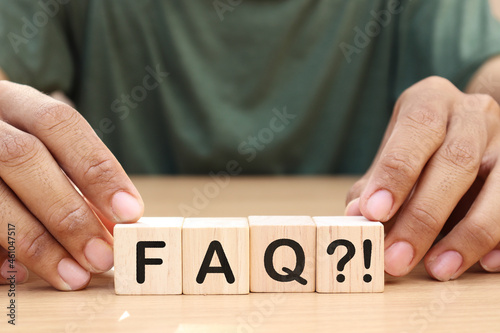 FAQ - text on wooden cubes on the wooden background