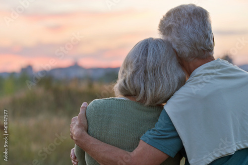 Portrait of senior woman and man in park