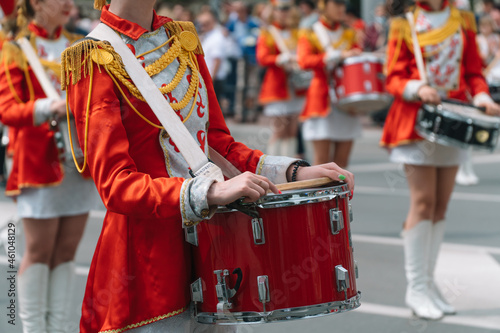 Young girls drummer at the parade. Street performance. Majorettes in the parade