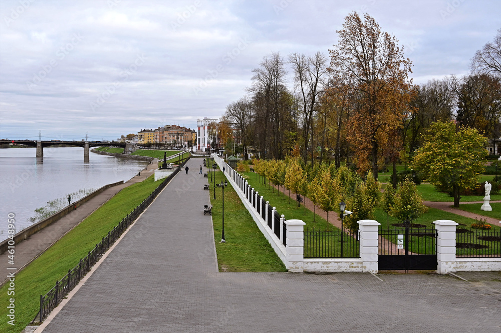 Beautiful city landscape with view of embankment, river and bridge over it. , Autumn park with yellow trees. Concept of tourism and recreation. Tver. Russia Beautiful city landscape with view of embankment, river and bridge over it. , Autumn park with yellow trees. Concept of tourism and recreation. Tver. Russia
