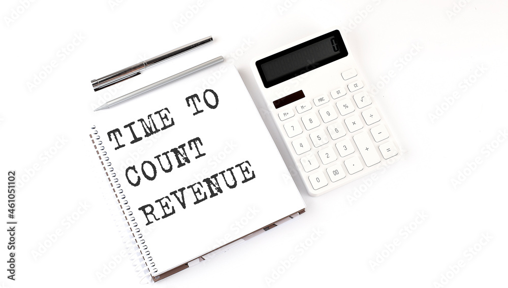 Notepad with text Time To Count Revenue with calculator and pen. White background. Business concept Notepad with text Time To Count Revenue with calculator and pen. White background. Business concept