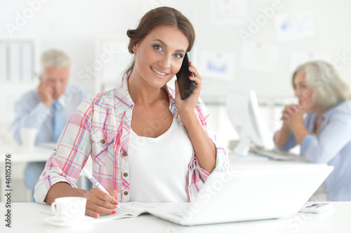 Portrait of beautiful young businesswoman working in office