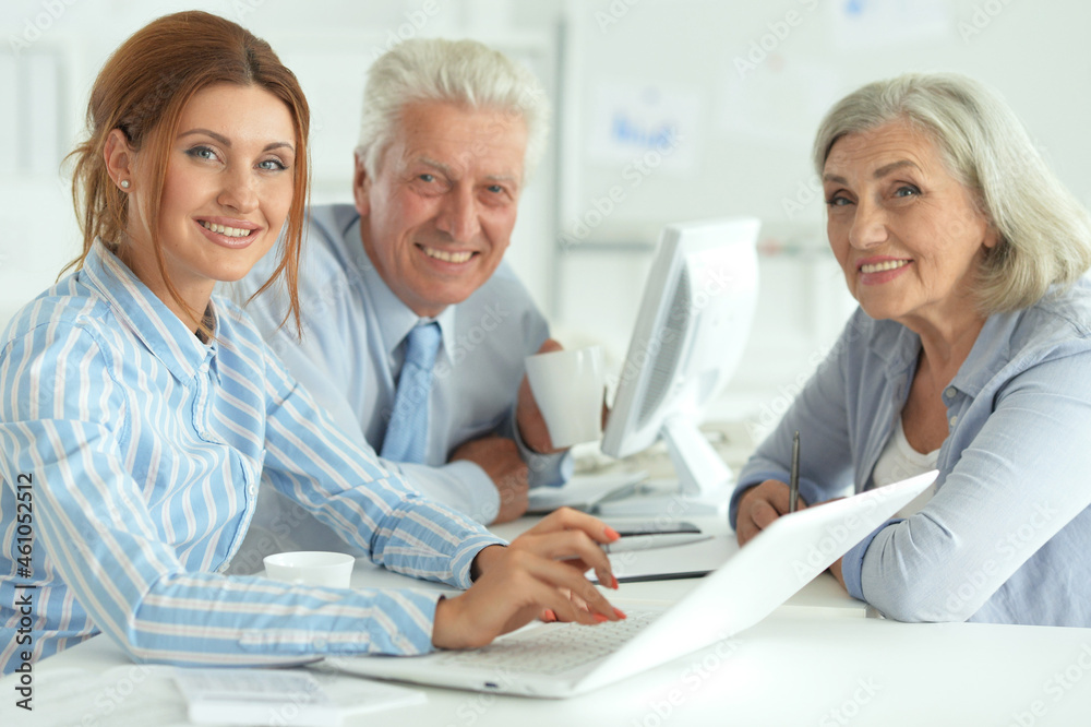 Portrait of group of successful business people in modern office