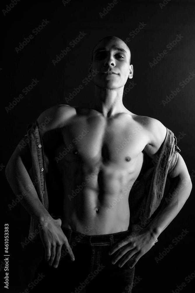 The muscular egyptian male on black background. Sexy naked torso. Sport workout bodybuilding concep. Muscular torso and chest. Isolated on black background.