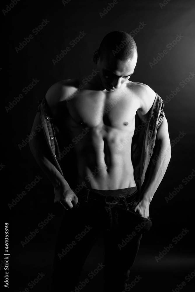 The muscular egyptian male on black background. Sexy naked torso. Sport workout bodybuilding concep. Muscular torso and chest. Isolated on black background.