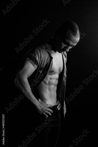 The muscular egyptian male on black background. Sexy naked torso. Sport workout bodybuilding concep. Muscular torso and chest. Isolated on black background. © MartaKlos