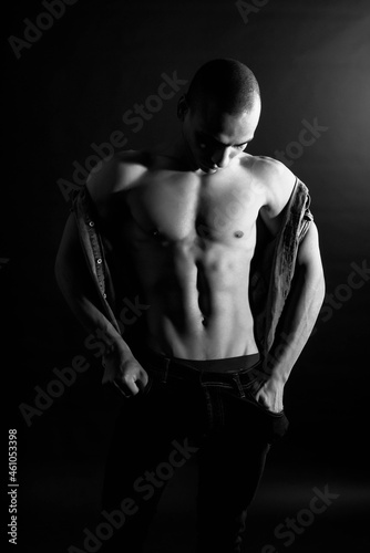 The muscular egyptian male on black background. Sexy naked torso. Sport workout bodybuilding concep. Muscular torso and chest. Isolated on black background.
