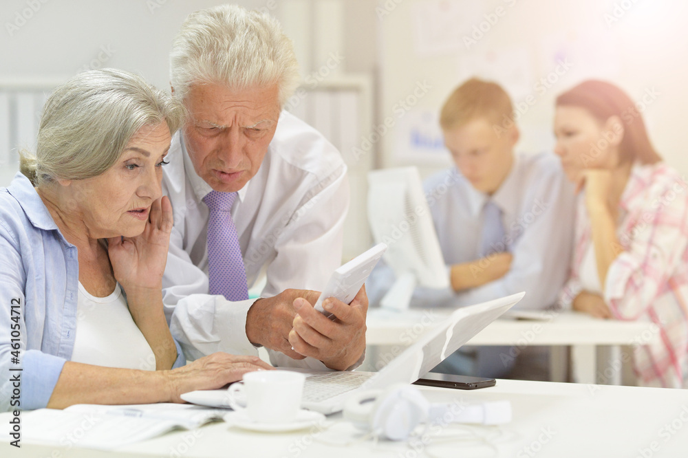 Portrait of successful senior businesspeople working together Portrait of successful senior businesspeople working together
