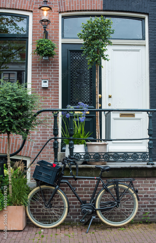 bicycle in front of a house in Amsterdam