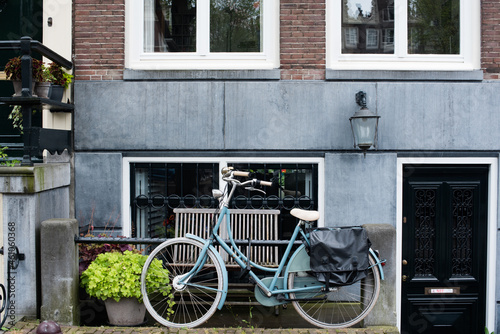 bicycle in front of a house in Amsterdam