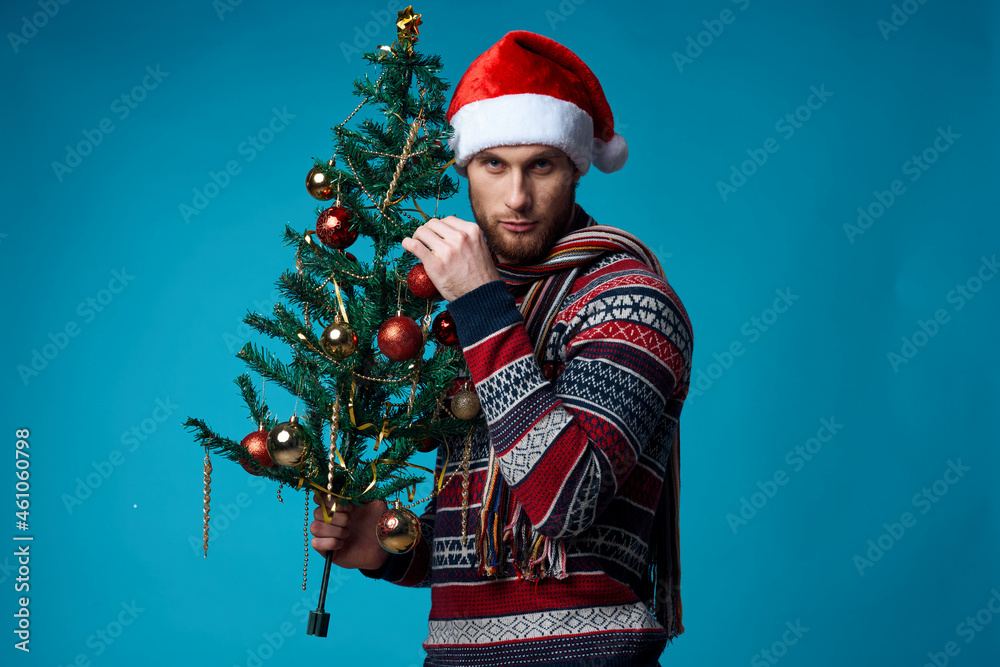 handsome man in New Year's clothes advertising copy space blue background handsome man in New Year's clothes advertising copy space blue background