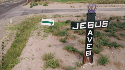 Aerial: Road sign cross in the countryside with Jesus Saves. Yerington, Nevada photo