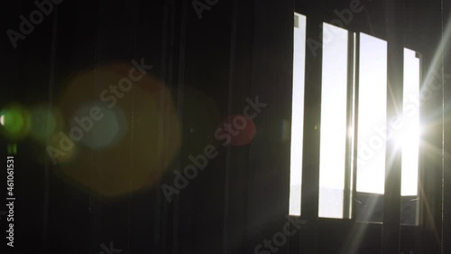 Sunshine through an abandoned building window in a subdivision photo