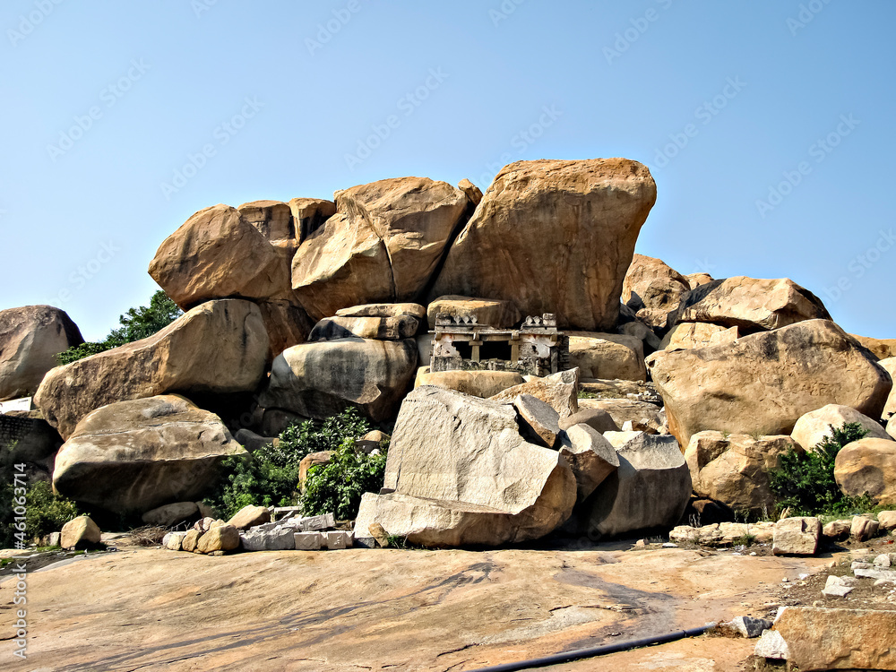 Ancient stone temples in solid rocks on hill in Hampi, Karnataka, India. Ancient stone temples in solid rocks on hill in Hampi, Karnataka, India.