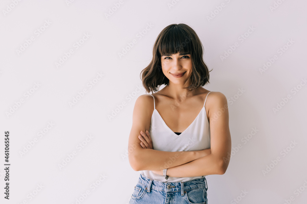Portrait of a happy woman standing isolated on a white background Portrait of a happy woman standing isolated on a white background