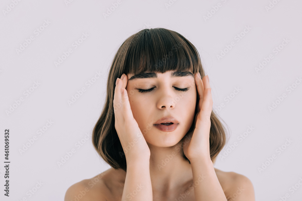Beautiful face of young woman with clean fresh skin - isolated on white background Beautiful face of young woman with clean fresh skin - isolated on white background
