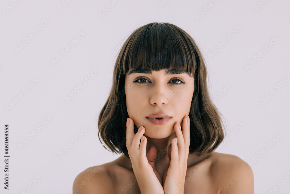 Beautiful face of young woman with clean fresh skin - isolated on white background Beautiful face of young woman with clean fresh skin - isolated on white background