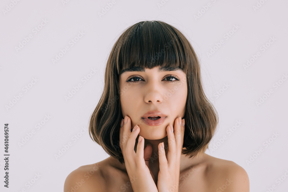 Beautiful face of young woman with clean fresh skin - isolated on white background Beautiful face of young woman with clean fresh skin - isolated on white background