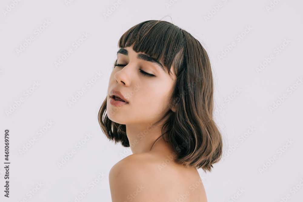 Beautiful Young woman touching her clean face with fresh healthy skin, isolated on white background. Beautiful Young woman touching her clean face with fresh healthy skin, isolated on white background.