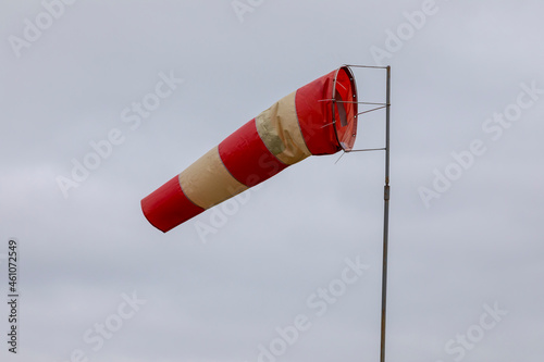 Windsock indicator of wind on runway airport. Wind cone indicating wind direction and force.